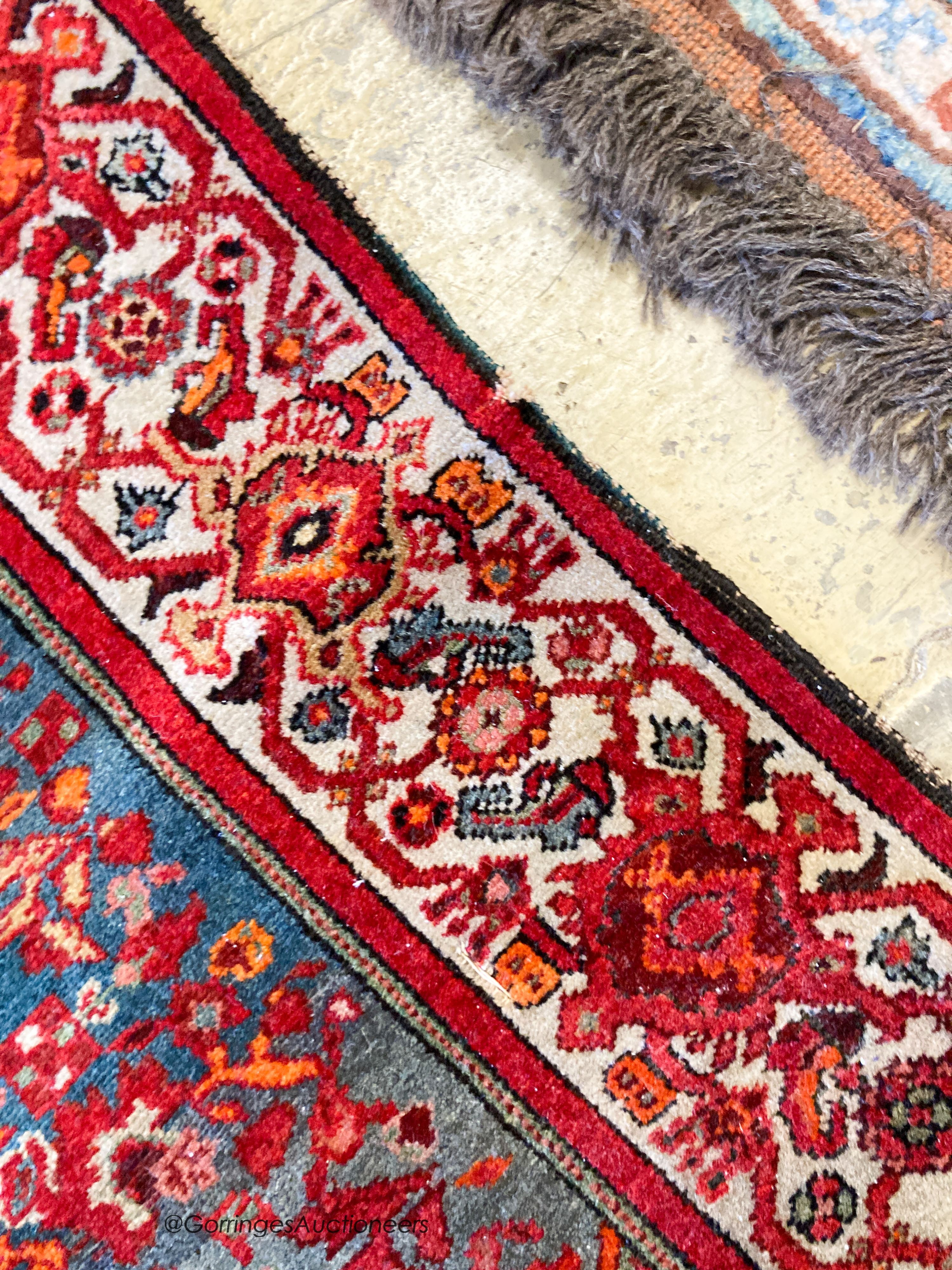 A North West Persain red ground rug, 200 x 132cm